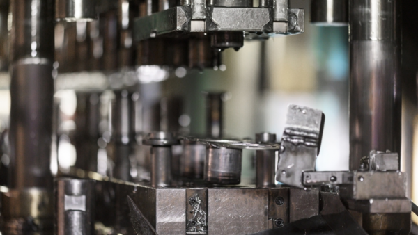 Close-up of a die in a machine shop, showcasing precision engineering and the integration of advanced die protection systems for enhanced performance and safety in metal stamping operations.