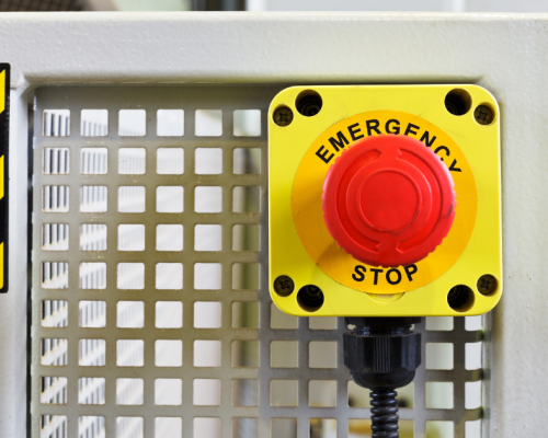 Emergency stop, or e-stop on a punch press machine in an industrial setting.