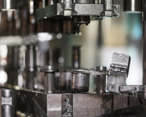 Close-up of a die in a machine shop, showcasing precision engineering and the integration of advanced die protection systems for enhanced performance and safety in metal stamping operations.